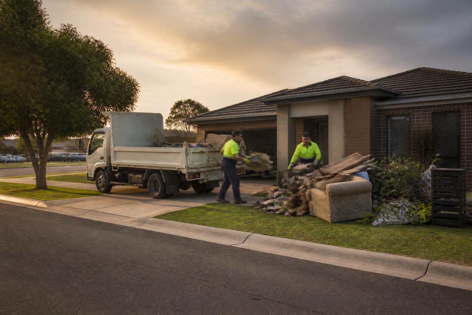 SWIFT crew loading household rubbish into a tipper truck outside a home in Melbourne's northern suburbs